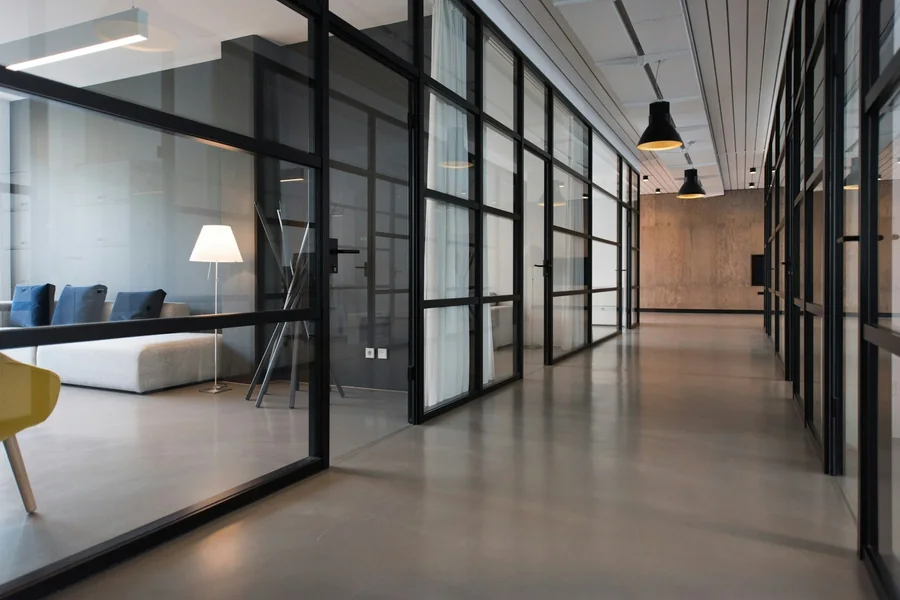 Foreign investor reviewing legitimate office lease and business premises documents in a modern China office