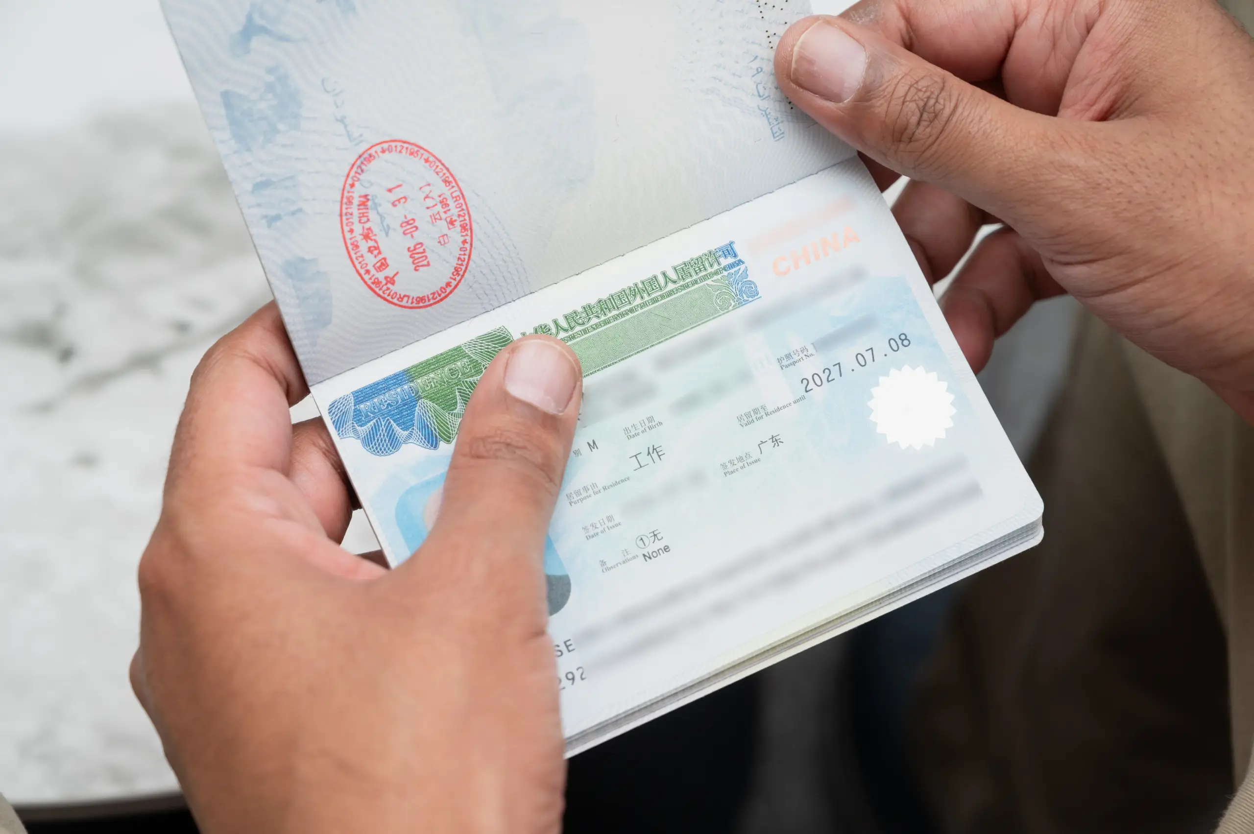 China foreigner residence permit for work shown in a passport